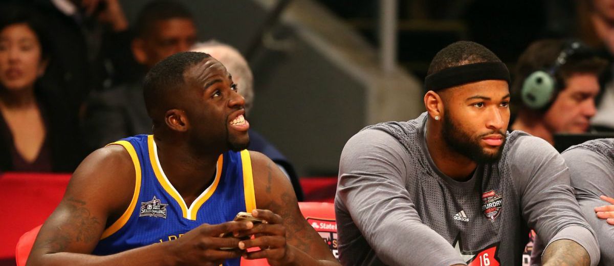 Draymond Green et DeMarcus Cousins sur le banc