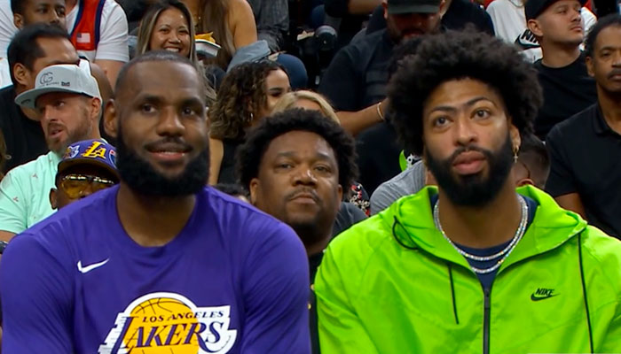 NBA stars LeBron James (left) and Anthony Davis (right) on the Los Angeles Lakers bench