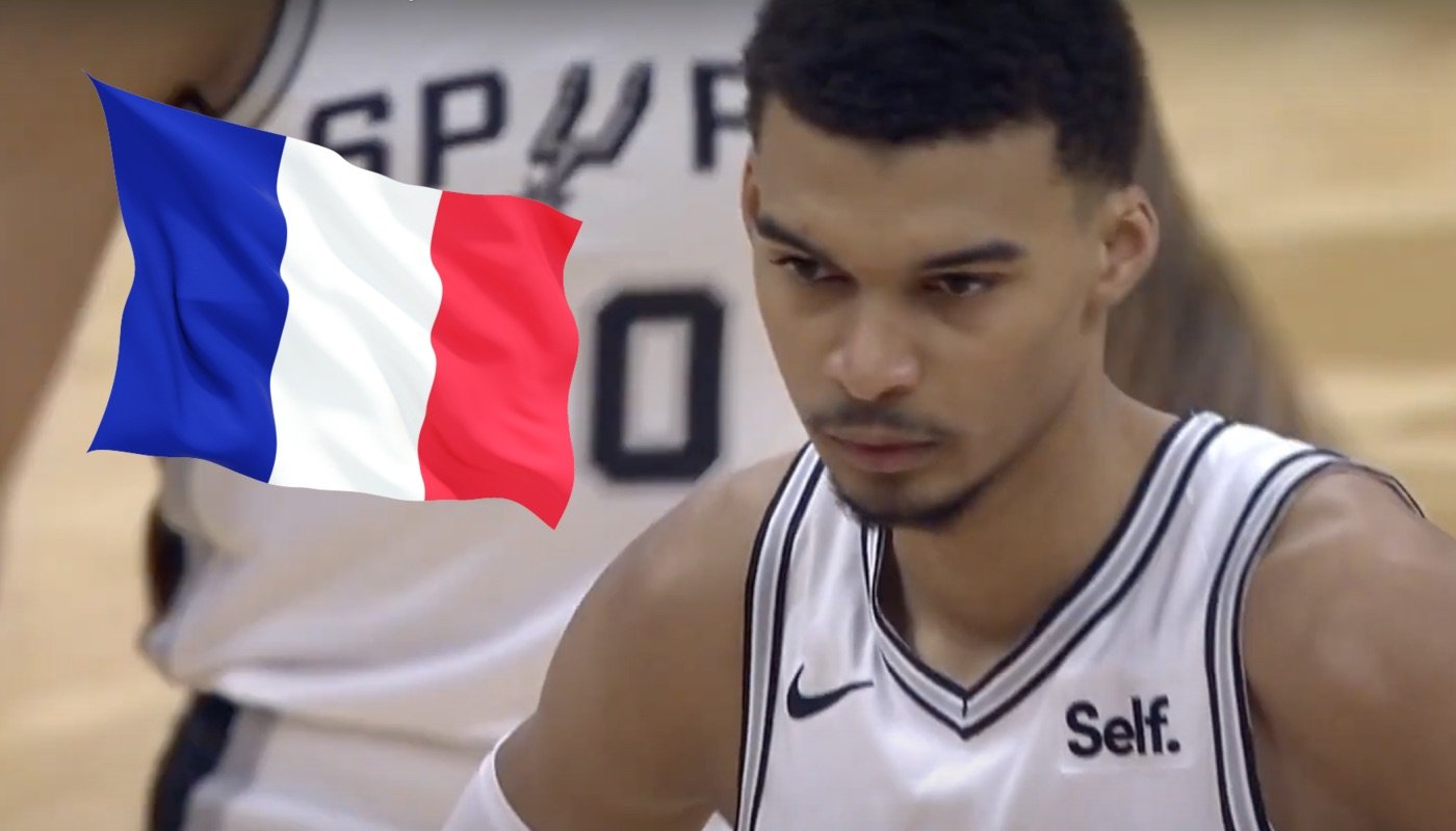 The young French NBA player Victor Wembanyama, here accompanied by the flag of France