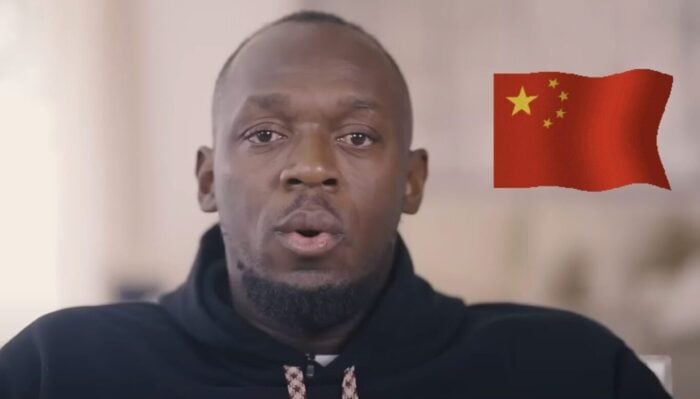 L'ancien sprinteur américain Usain Bolt, ici accompagné du drapeau chinois