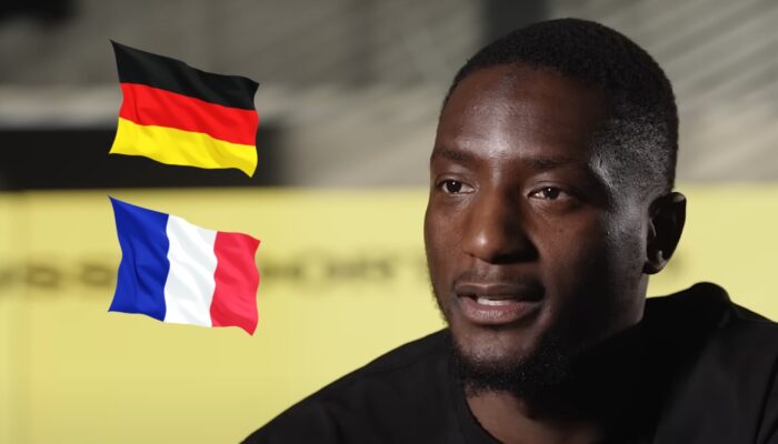 L'attaquant guinéen Serhou Guirassy, ici accompagné des drapeaux de l'Allemagne et de la France